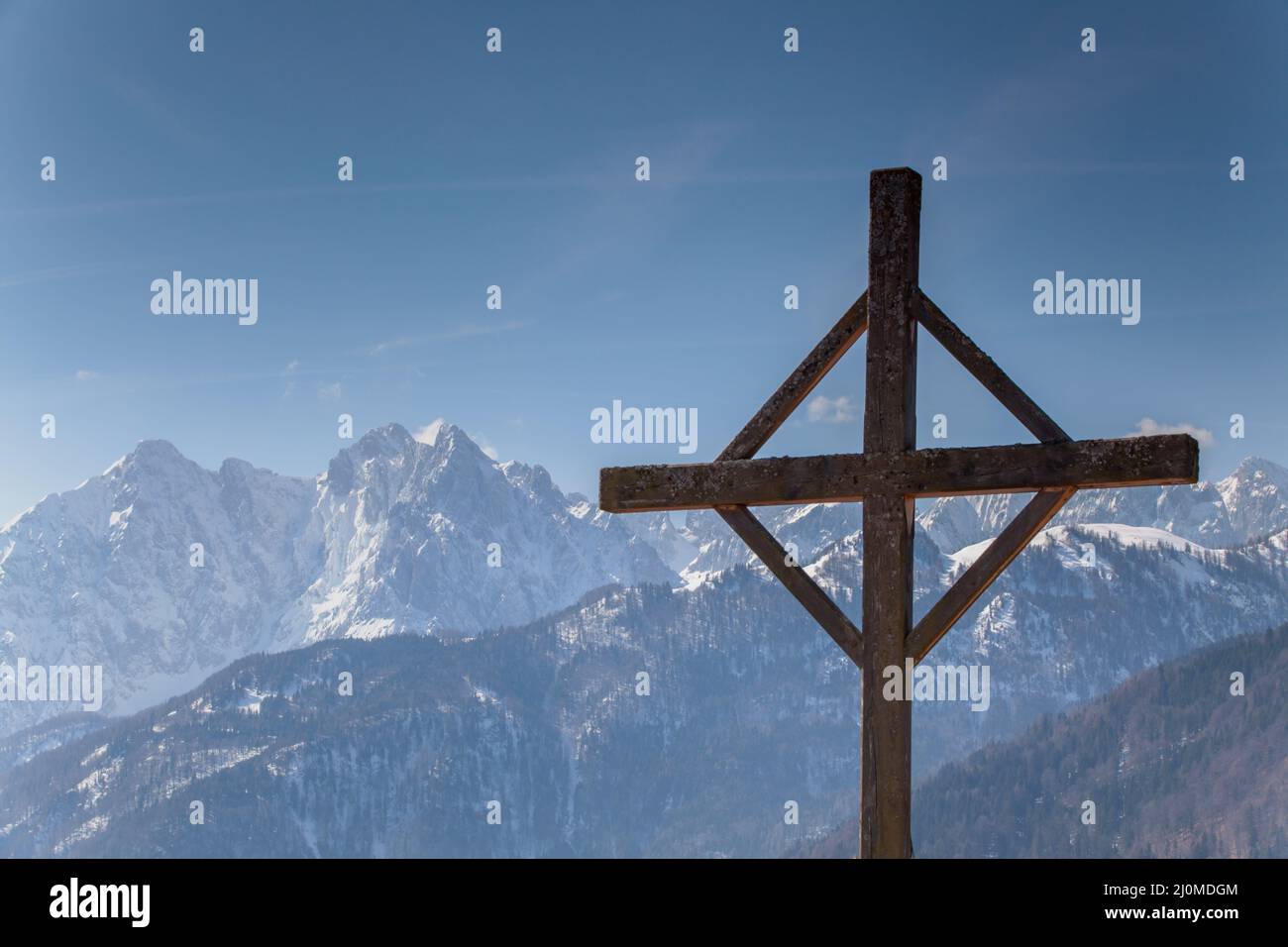 Cross in the Tyrolean Alps in winter Stock Photo