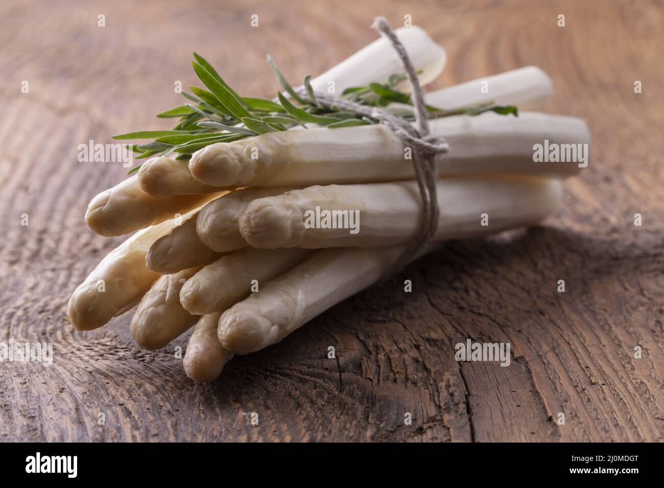 Bunch of white asparagus on wood Stock Photo