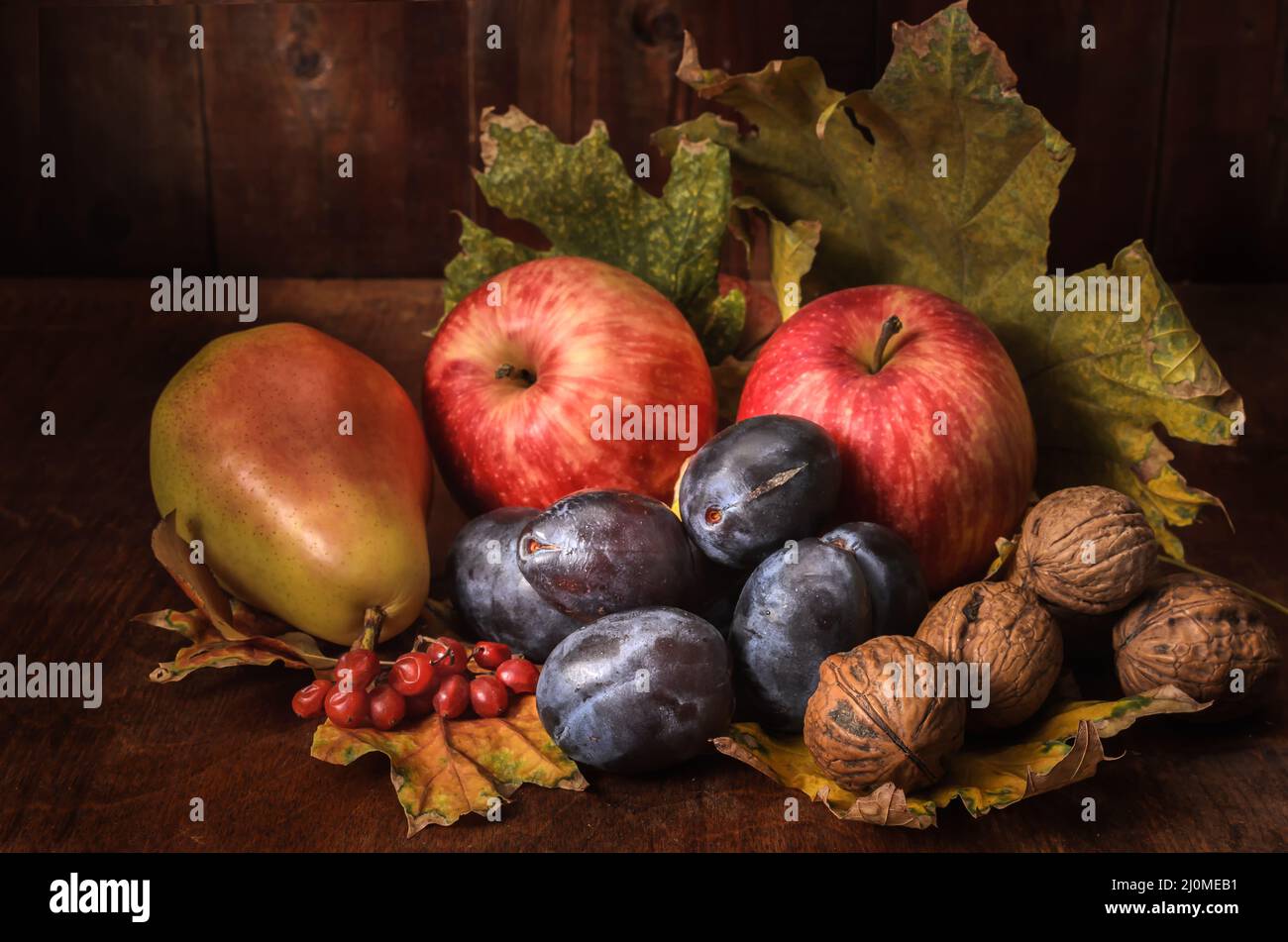 Fruits in bulk on a dark wooden background in a rustic style Stock Photo