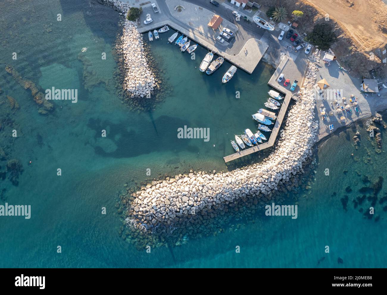 Aerial drone view of fishing boats moored at the harbor. moored at ...
