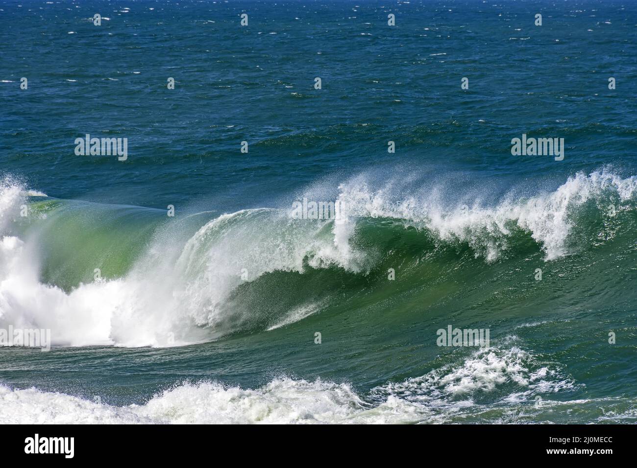 Wave breaking hard in Ipanema sea waters Stock Photo