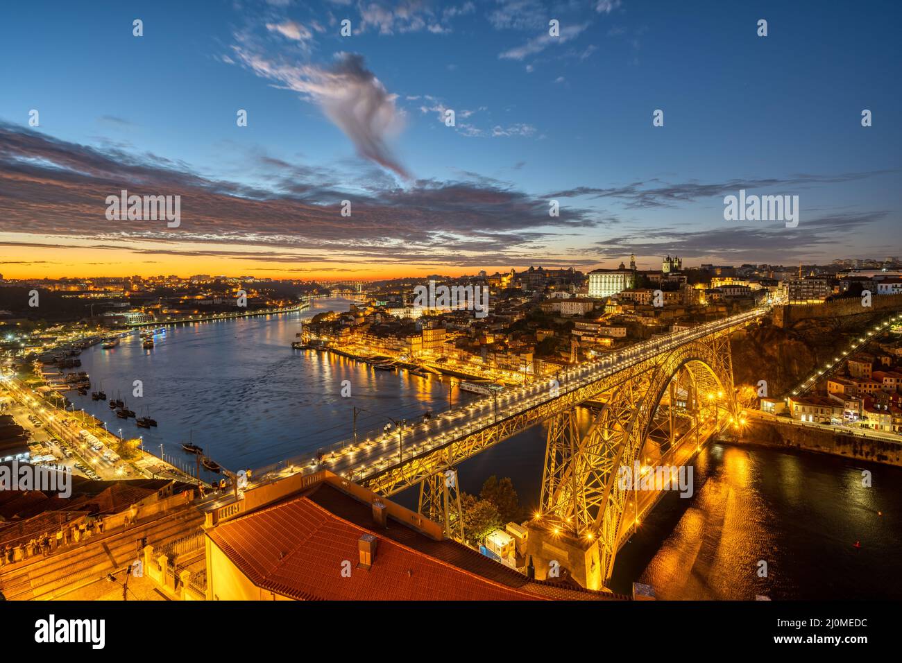 View of Porto with the river Douro and the Dom Luis I bridge after sunset Stock Photo