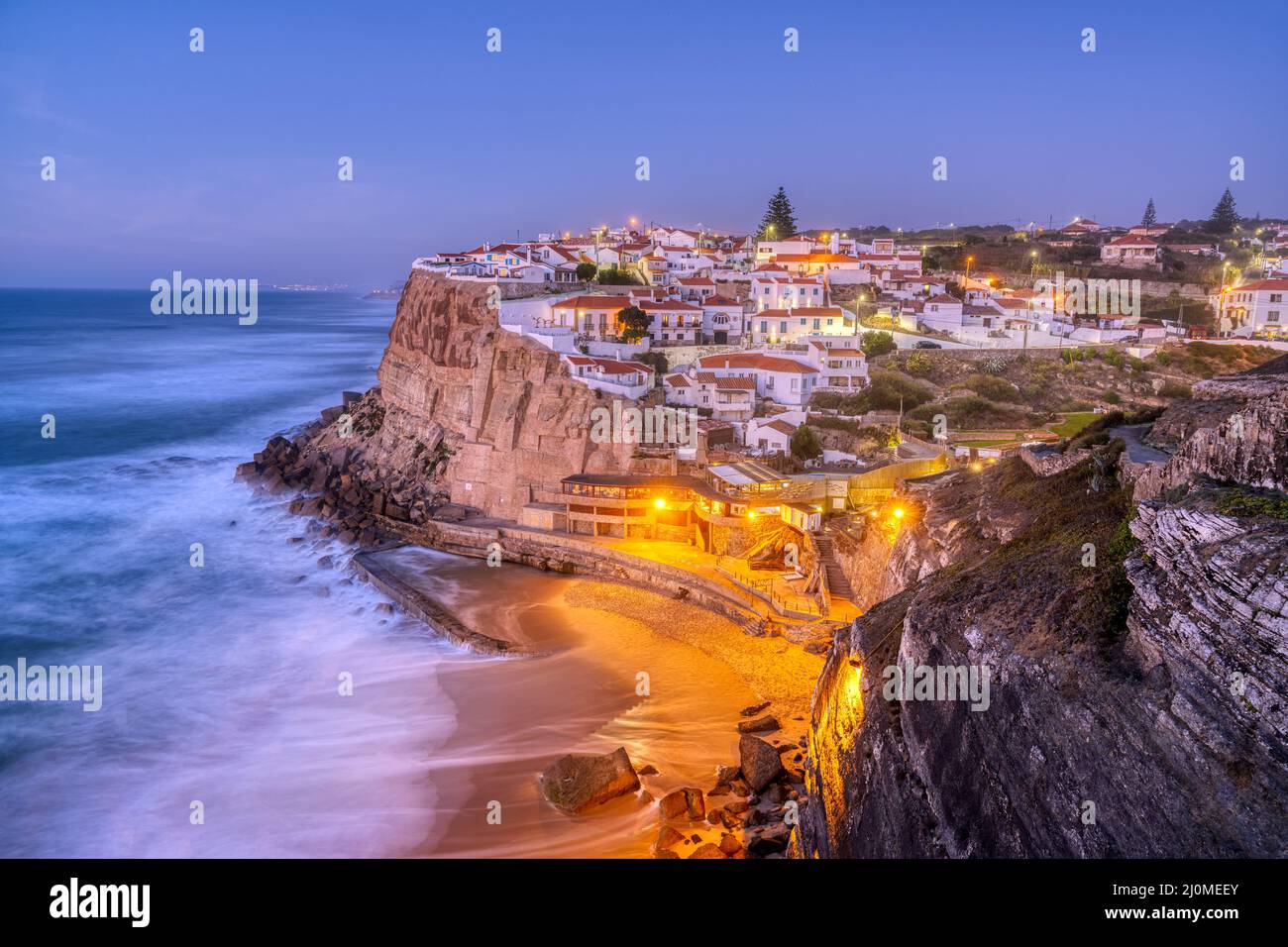 The beautiful village of Azenhas do Mar at the portuguese Atlantic coast after sunset Stock Photo