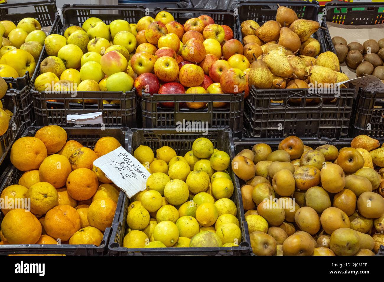 Apples, oranges and pears for sale at a market Stock Photo
