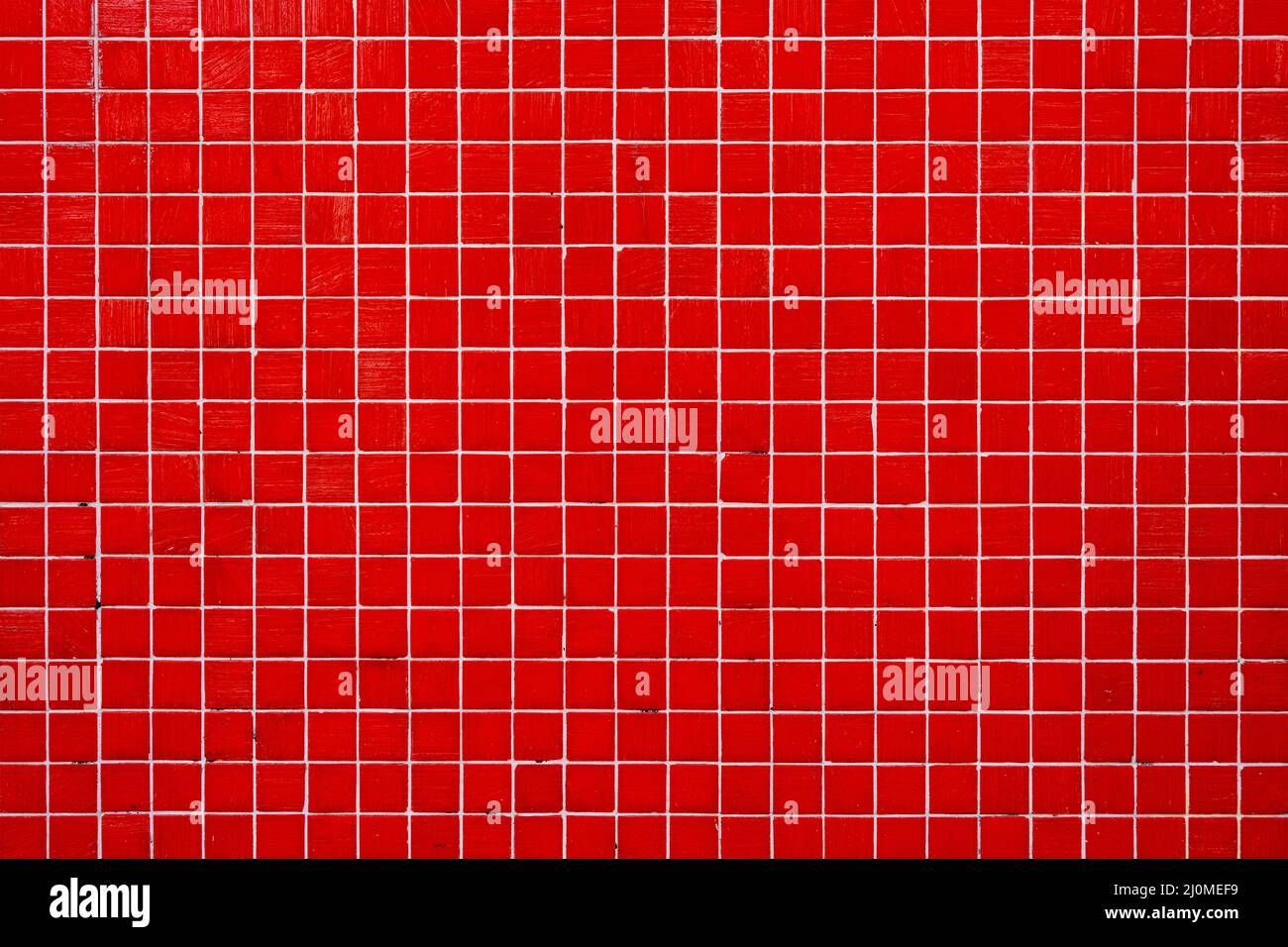 Background from a wall made of red mosaic tiles Stock Photo