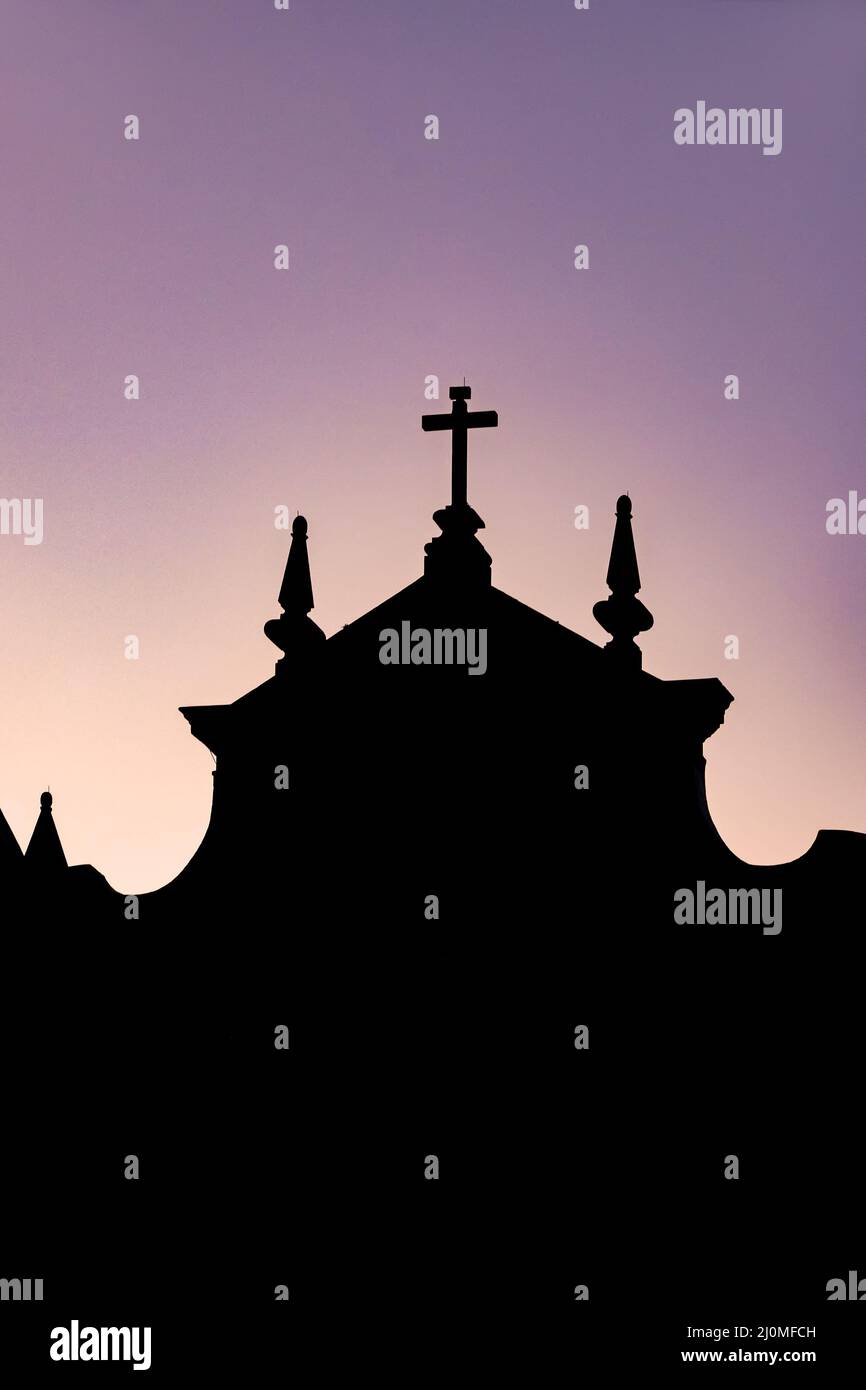 Silhouette of a colonial-style historic church during sunset Stock Photo