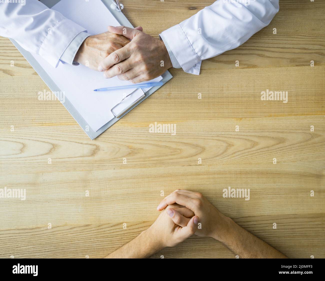 Hands anonymous doctor patient table Stock Photo Alamy