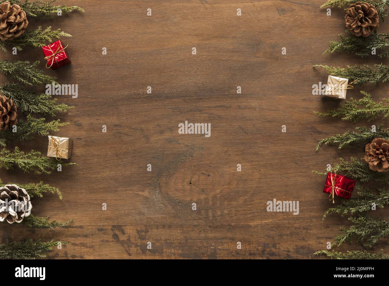 Green branches with small gift boxes Stock Photo - Alamy