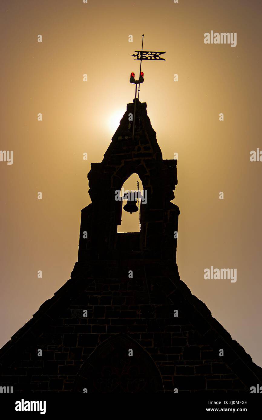 Silhouette of old church bell tower at sunset in Bulla Victoria Stock Photo