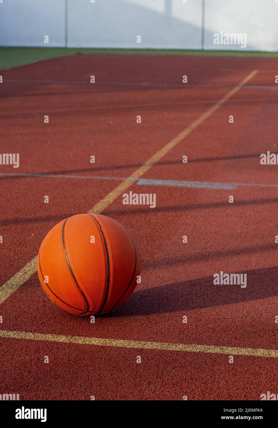 Basketball ball in the outdoor public court Stock Photo Alamy