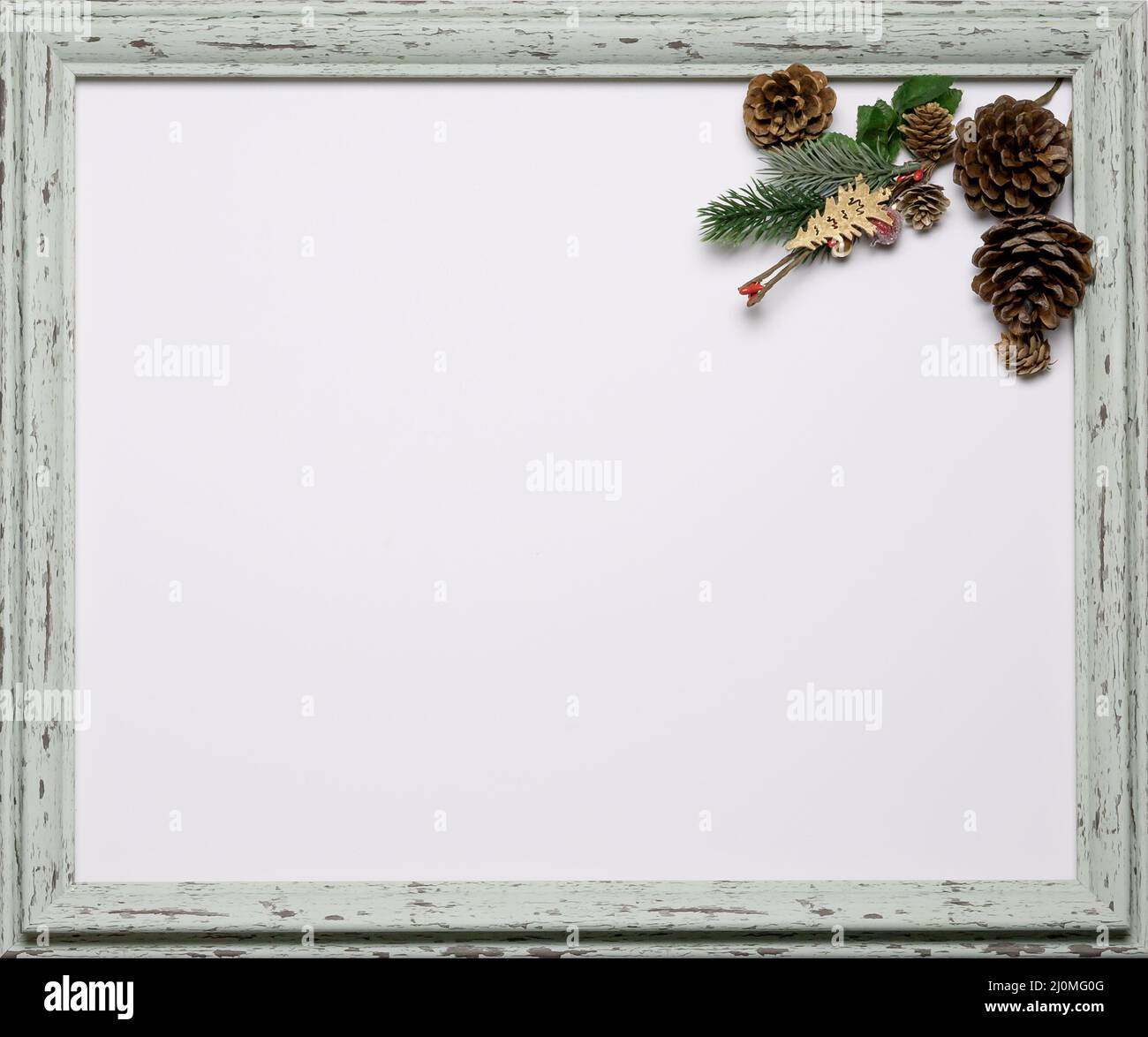 Blank Christmas themed card with a place for an inscription, framed in a decorative frame. Festive mockup. Flatlay composition Stock Photo
