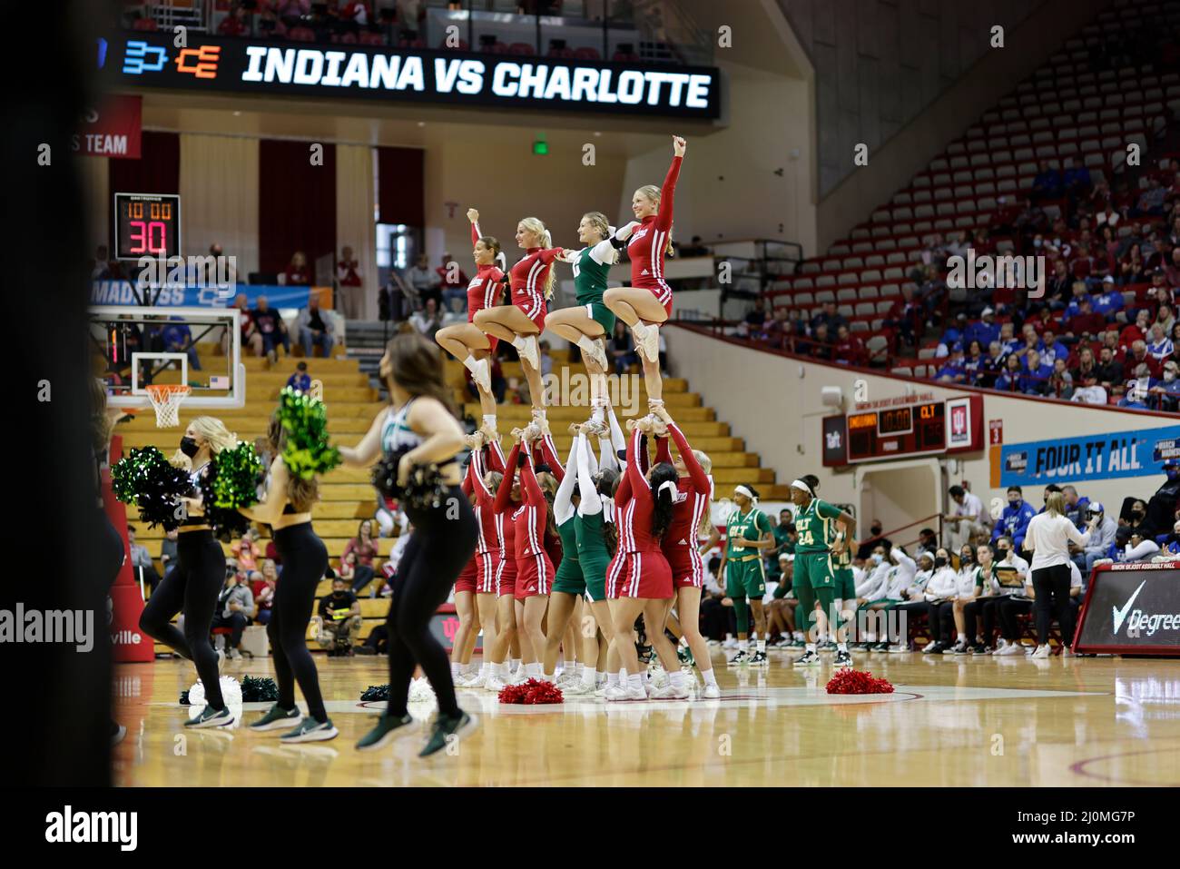 Bloomington, United States. 19th Mar, 2022. Indiana and Charlotte cheerleaders make a formation together during round 1 of the 2022 Division 1 Women's Basketball Championship, at Simon Skjodt Assembly Hall in Bloomington. Indiana University beat Charlotte 85-51. (Photo by Jeremy Hogan/SOPA Images/Sipa USA) Credit: Sipa USA/Alamy Live News Stock Photo