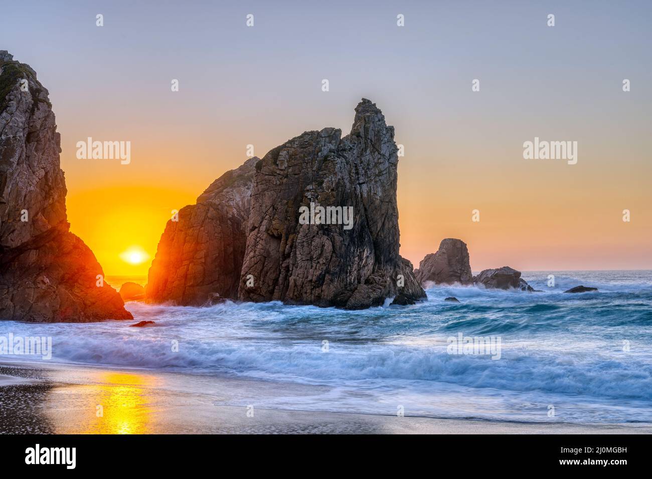 Beautiful sunset on a rocky beach at the portuguese atlantic coast Stock Photo