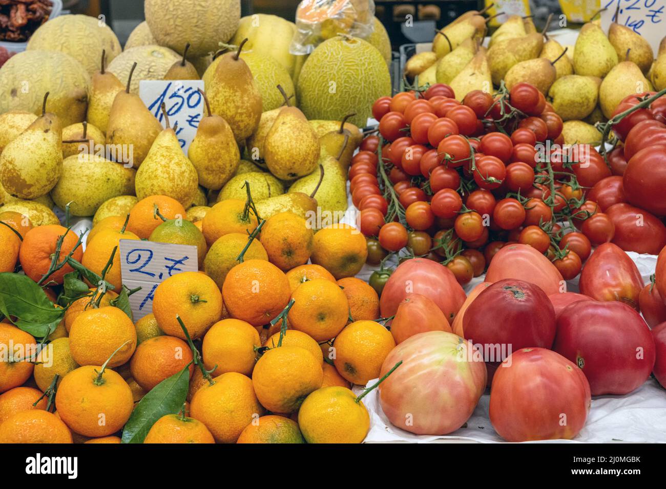 Fresh fruits and tomatoes for sale on a market Stock Photo
