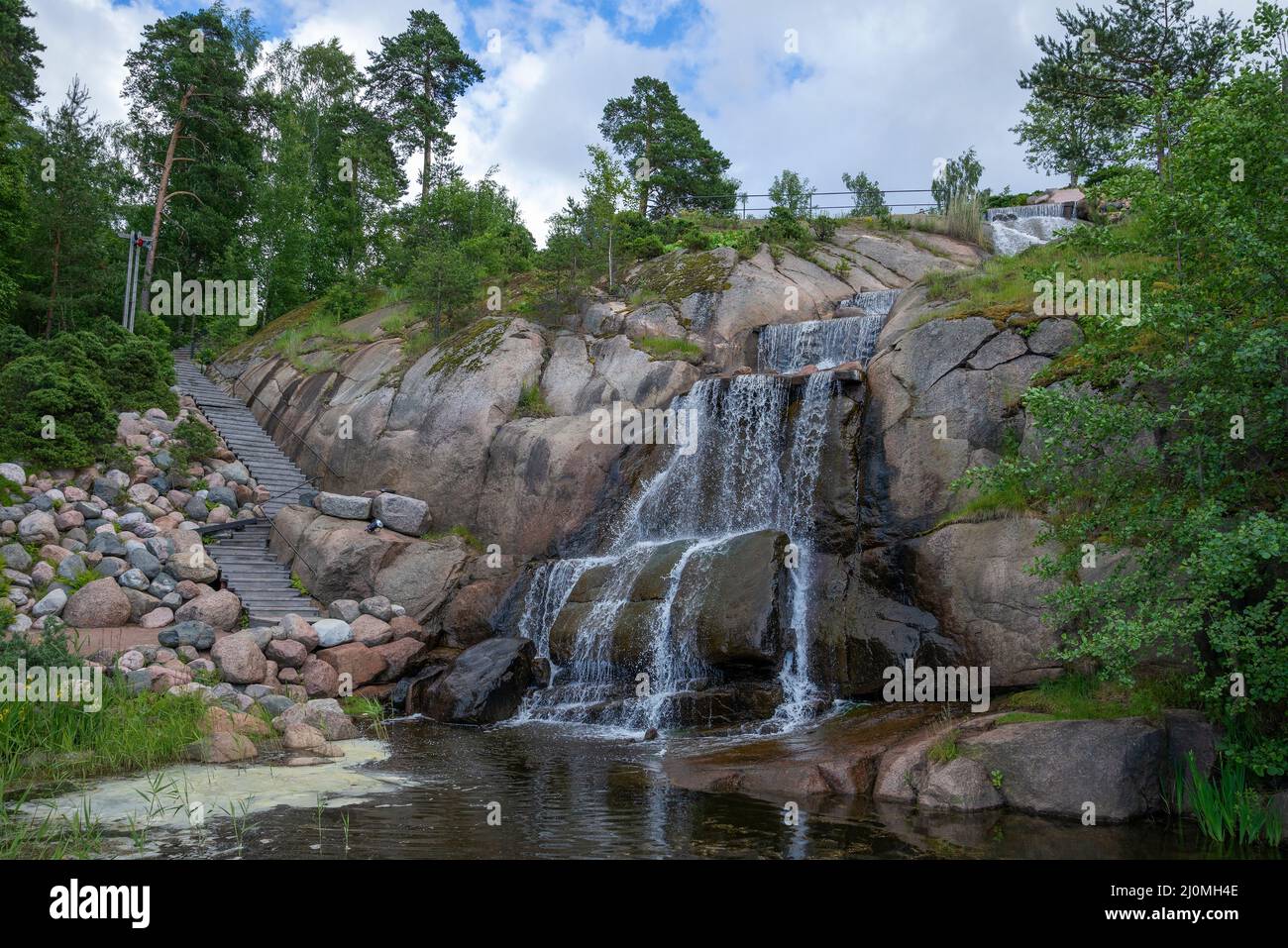 Putouskallio rock with waterfall in Sapocca Park. Kotka, Finland Stock Photo