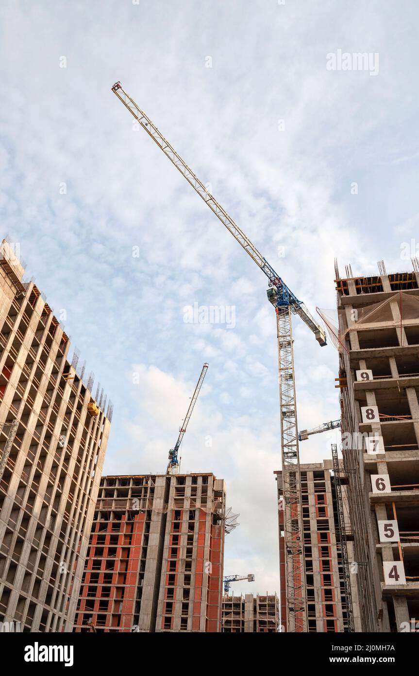 A crane on the construction of a high-rise building. Saint-Petersburg Stock Photo