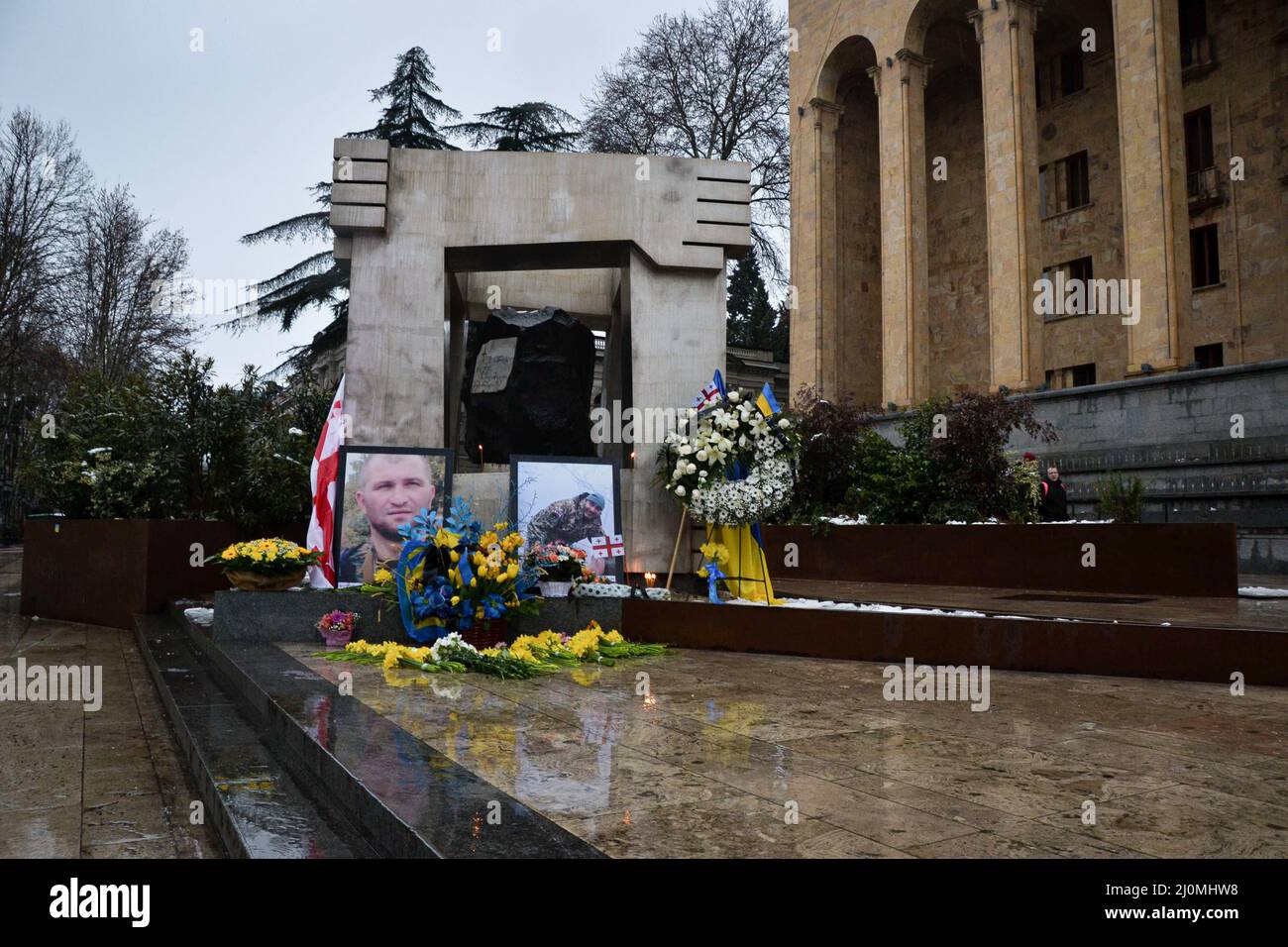 Tbilisi, Georgia. 19th Mar, 2022. A tribute with the photos of two Georgian volunteers Gia Beriashvili and David Ratiani killed in the Ukraine-Russia war on March 18th. Special units were created for some of the larger groups of foreigner fighters, including a Georgian and a Chechen battalion since 2014 in Ukraine. Russia invaded Ukraine on 24 February 2022, triggering the largest military attack in Europe since World War II. Credit: SOPA Images Limited/Alamy Live News Stock Photo