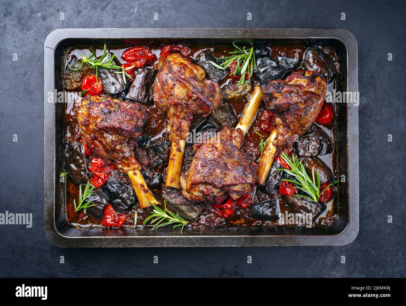Traditional braised slow cooked lamb shank in red wine sauce with
