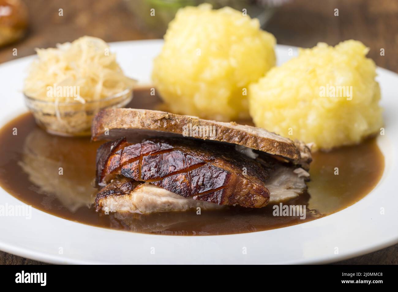 Bavarian roast pork with dumplings Stock Photo Alamy