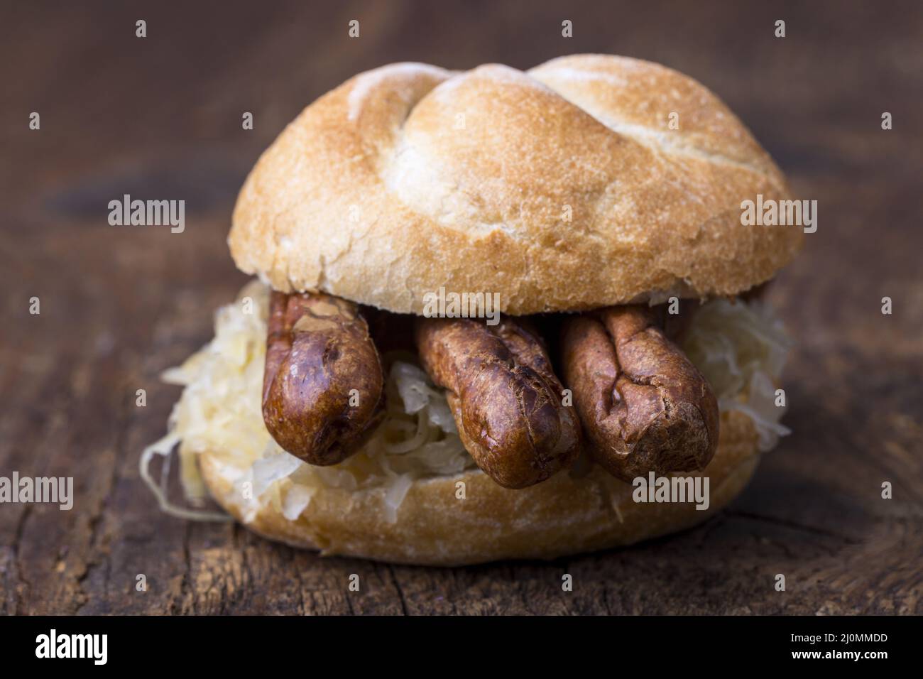 Nuremberg sausages with sauerkraut in a roll Stock Photo Alamy