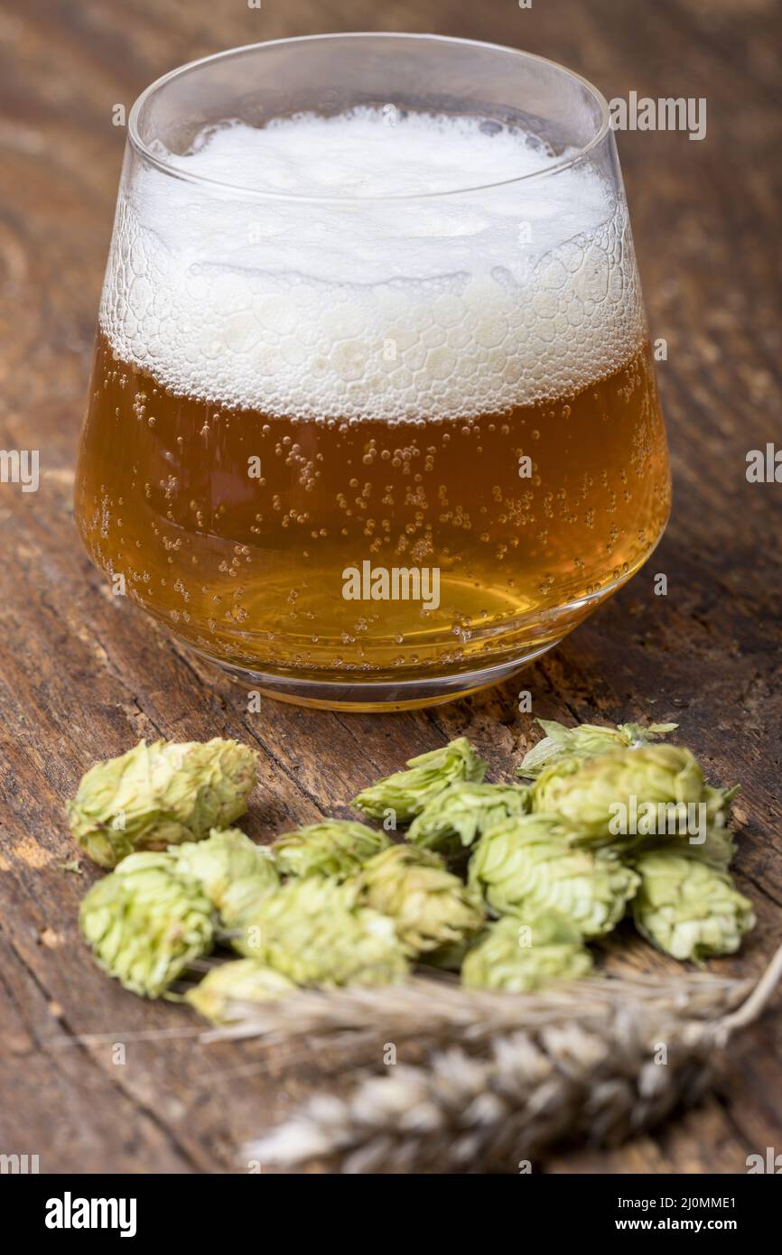 Indian Pale Ale with hops on wood Stock Photo
