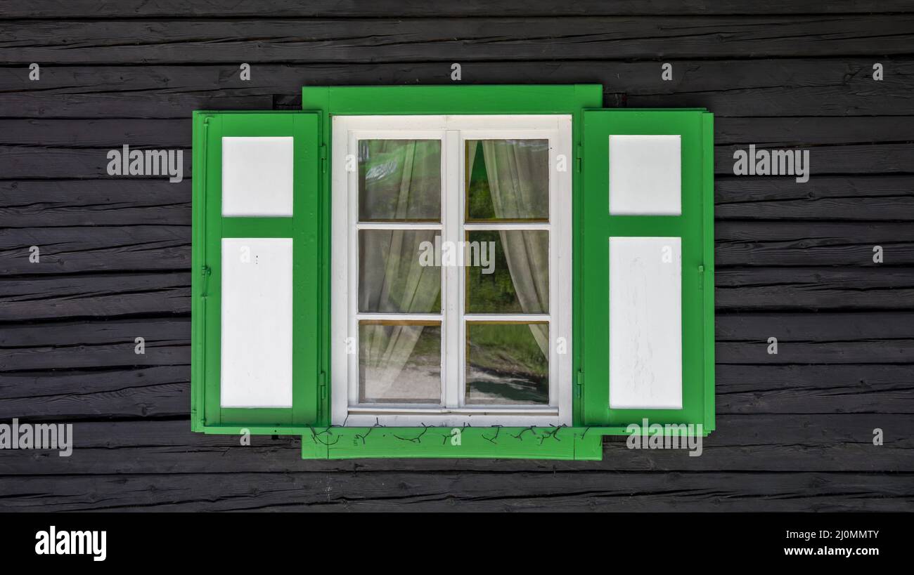 Old antique white vintage wooden window with green outline with ...
