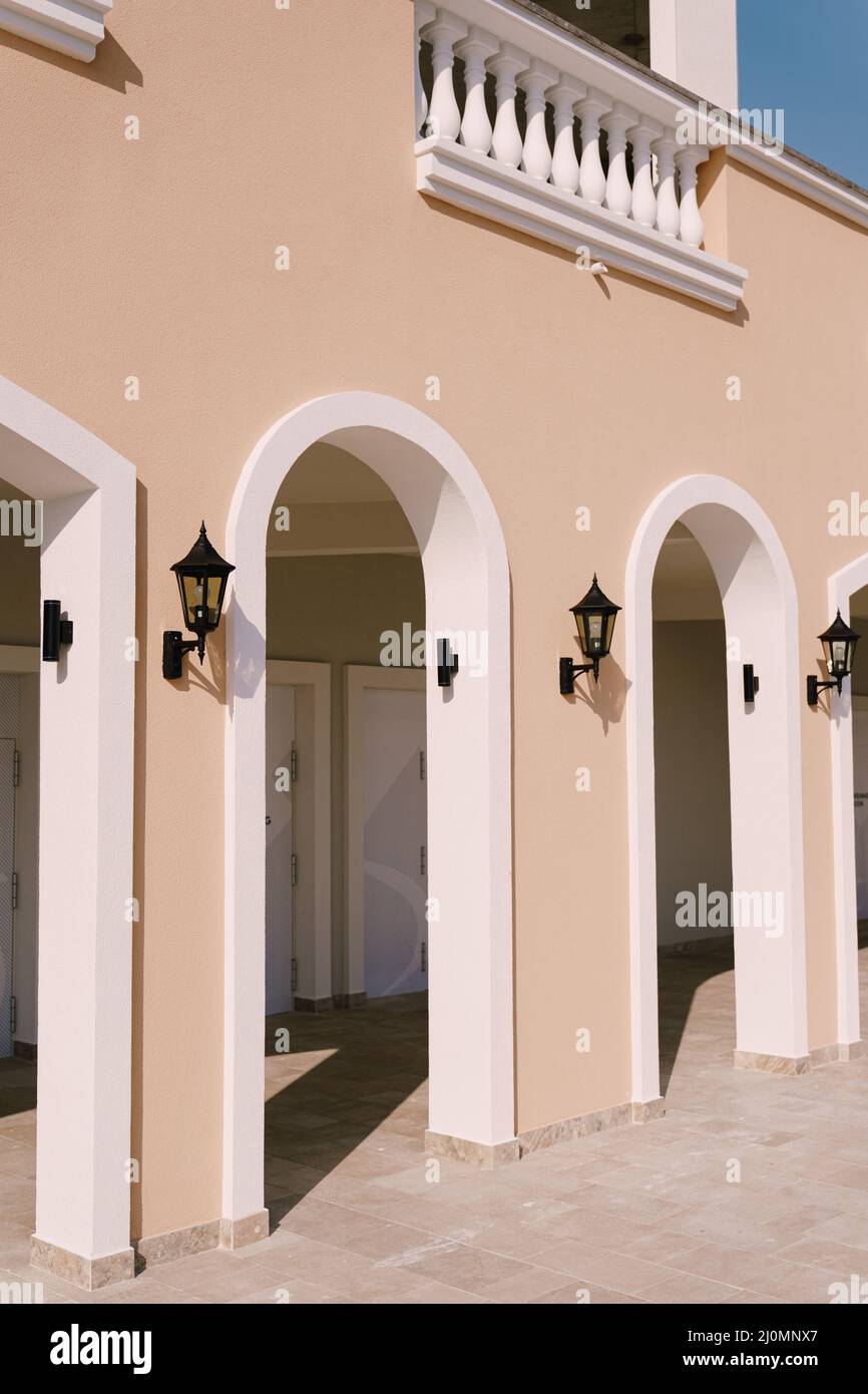Covered terrace with arched entrances in a residential complex. Lustica Bay, Montenegro Stock Photo