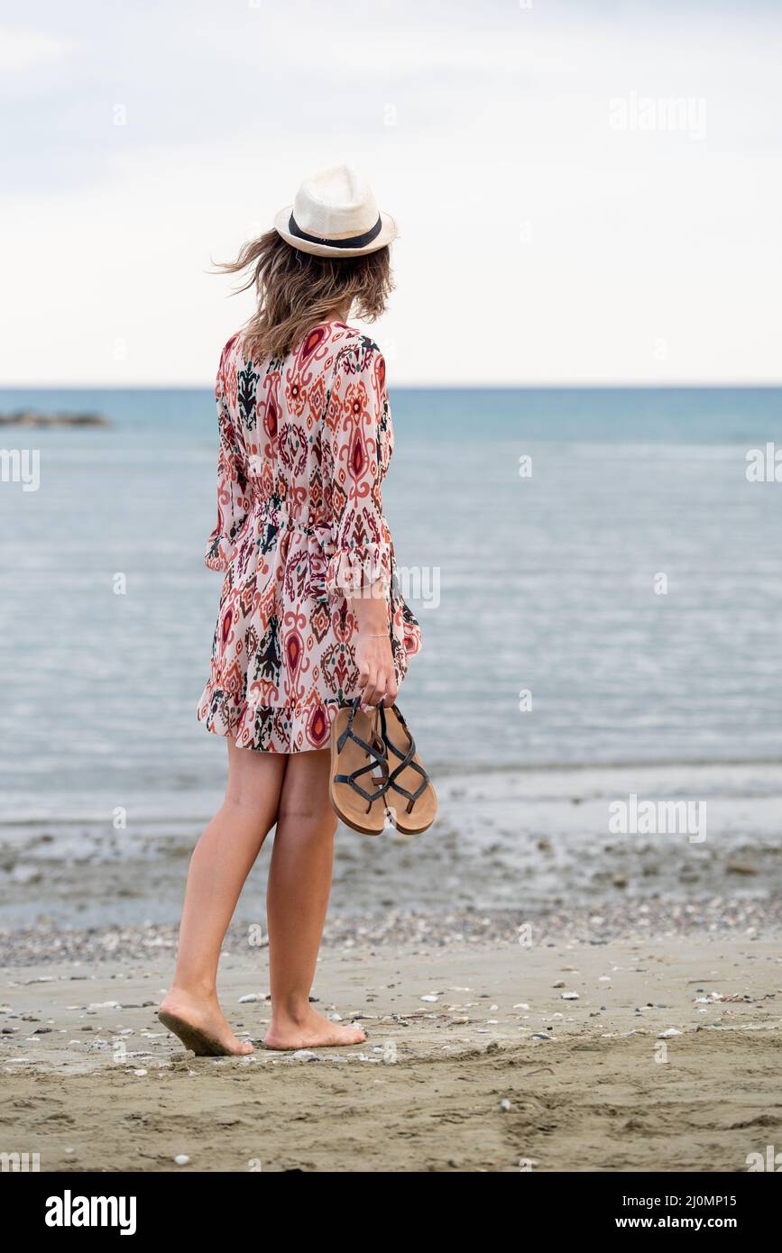 Woman walking barefoot beach hi-res stock photography and images - Alamy