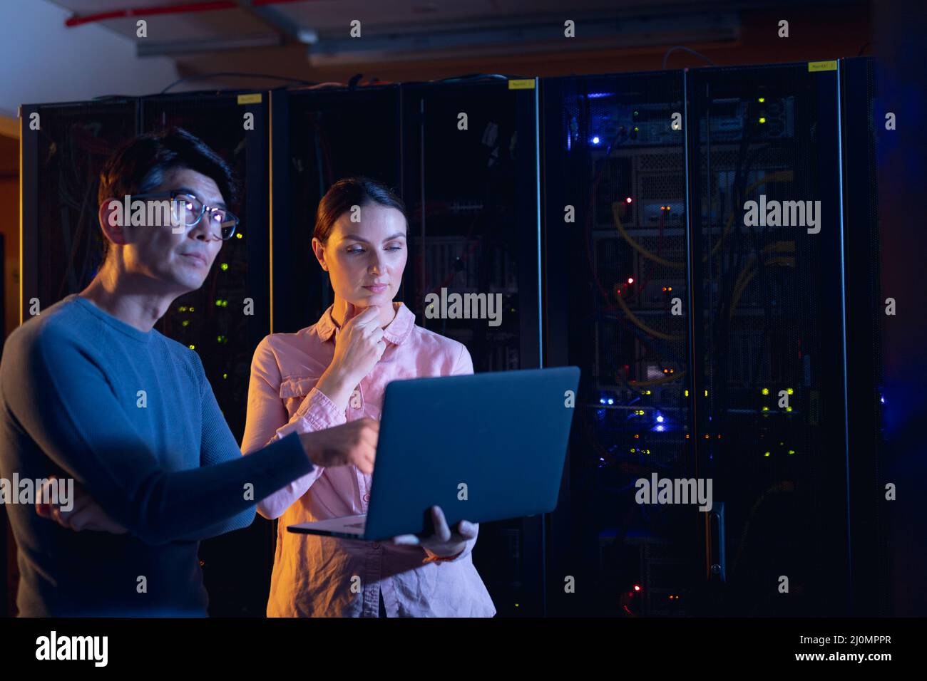 Male female server engineers using hi-res stock photography and images ...