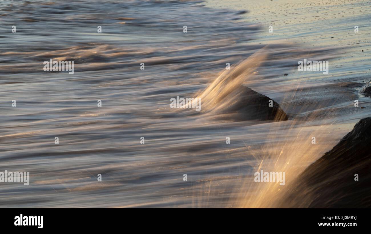 Slow motion sandy beach waves hi-res stock photography and images - Alamy