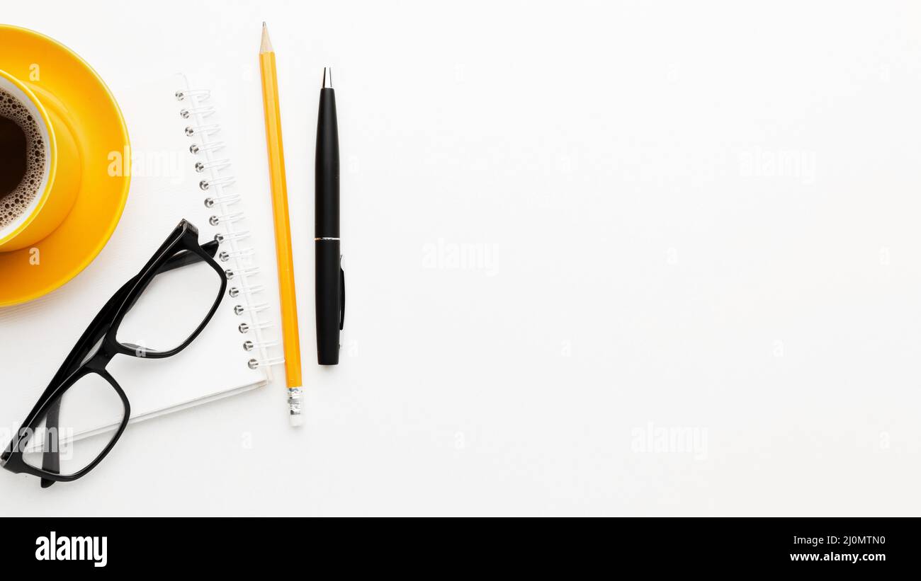 Flat lay frame with glasses pen Stock Photo