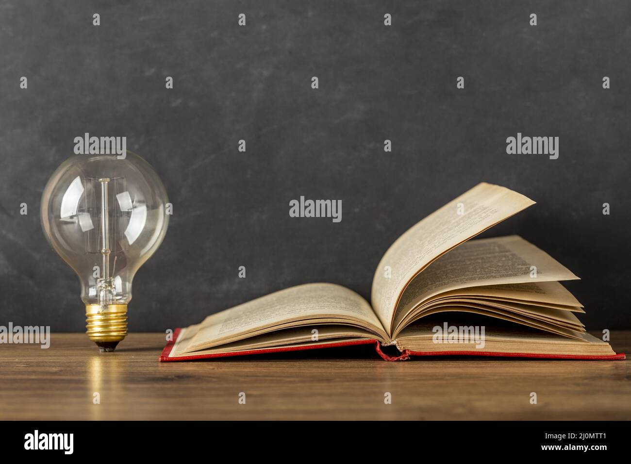 Composition with book light bulb Stock Photo Alamy