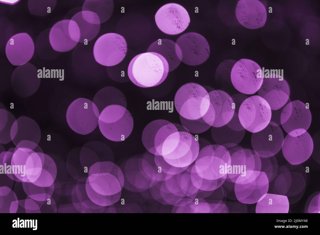 Abstract purple defocused circular light backdrop Stock Photo