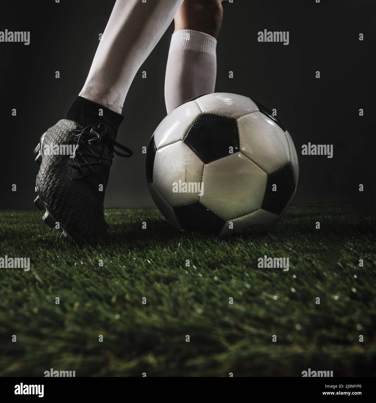Female football player kicking ball hi-res stock photography and images ...