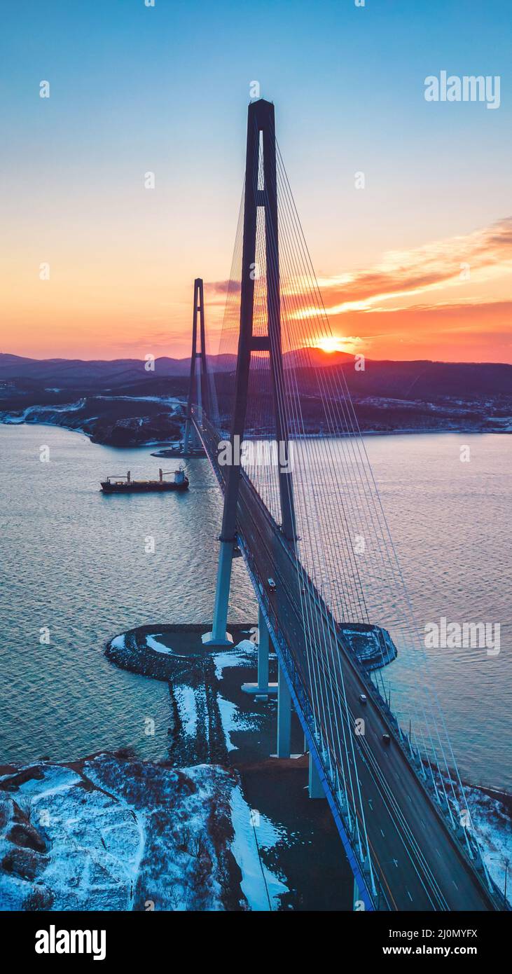 Winter aerial view of sunset over famous cable-stayed bridge from ...