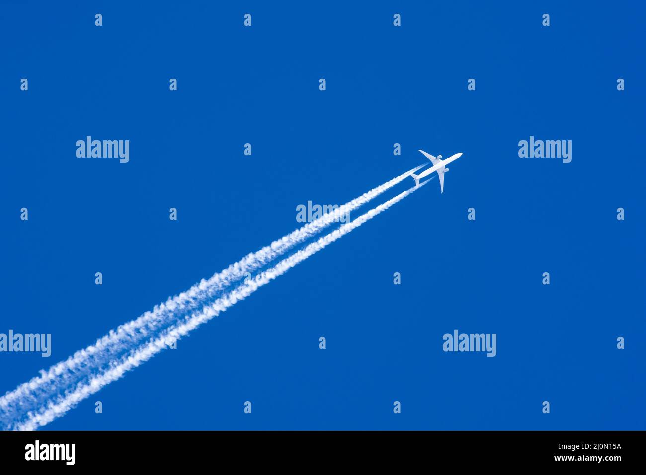 White aircraft big two engines aviation airport contrail clouds Stock ...