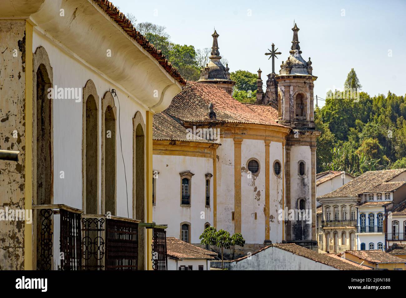 Old baroque church among the houses Stock Photo