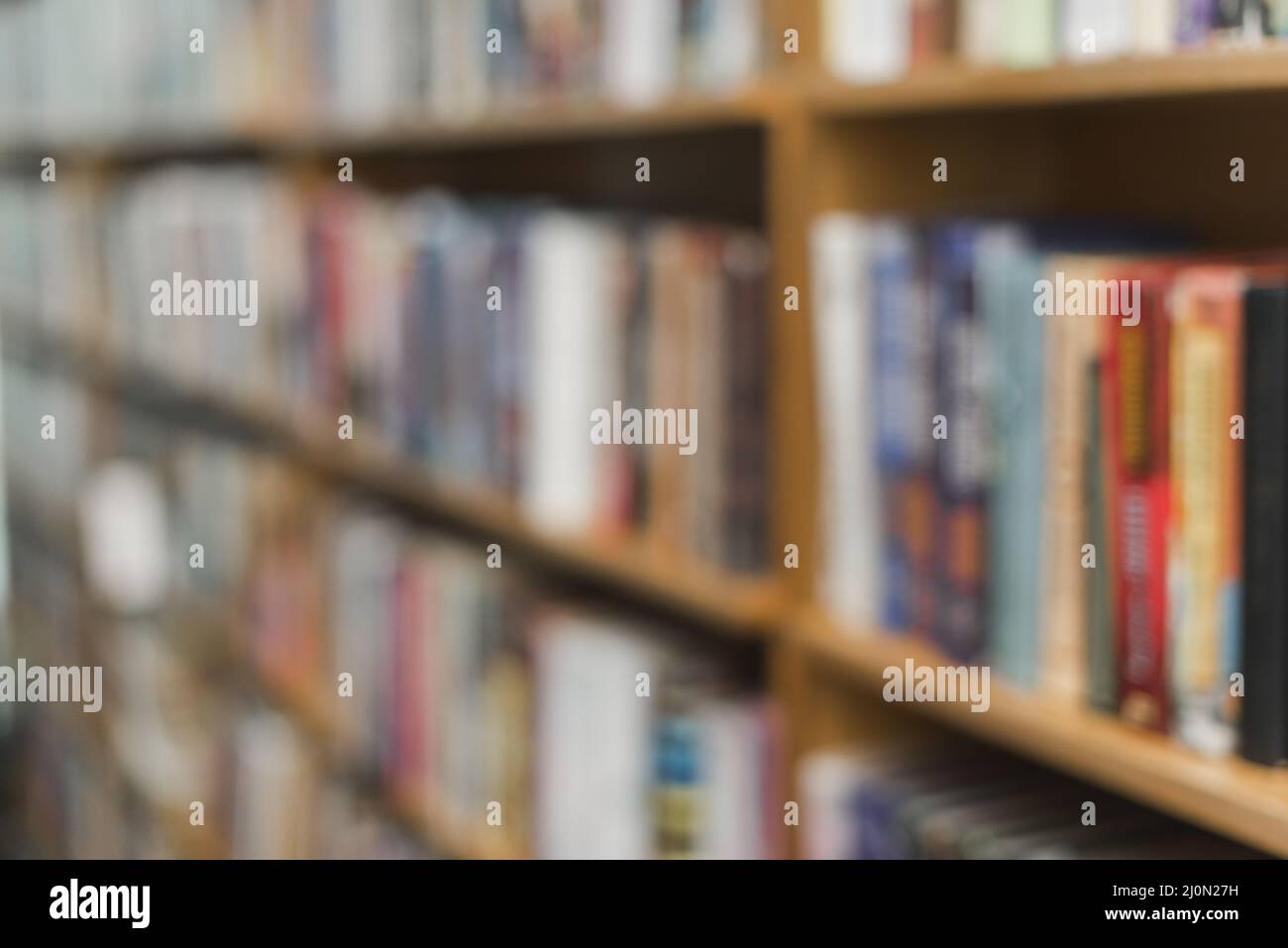 Blurred books library shelves Stock Photo