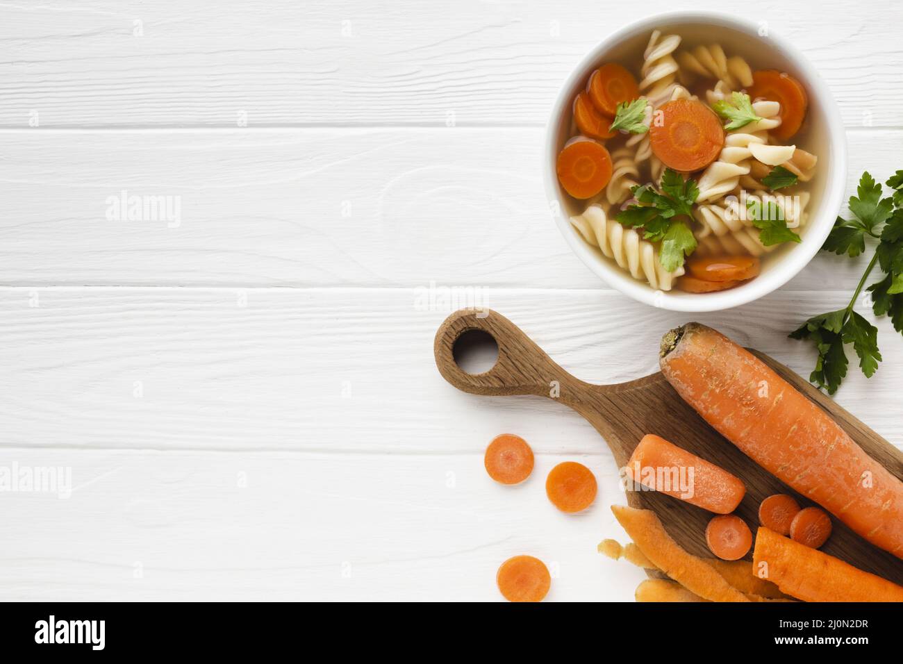 Flat lay fusilli broccoli carrots bowl with copy space Stock Photo