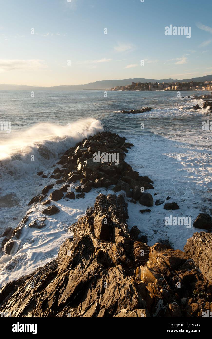 storm surge at sunset in Genoa in Liguria, Italy Stock Photo