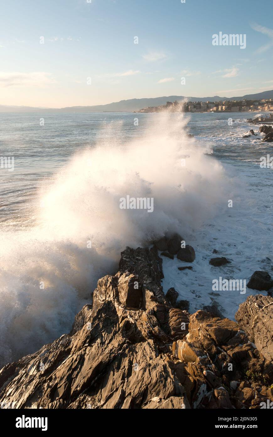 storm surge at sunset in Genoa in Liguria, Italy Stock Photo