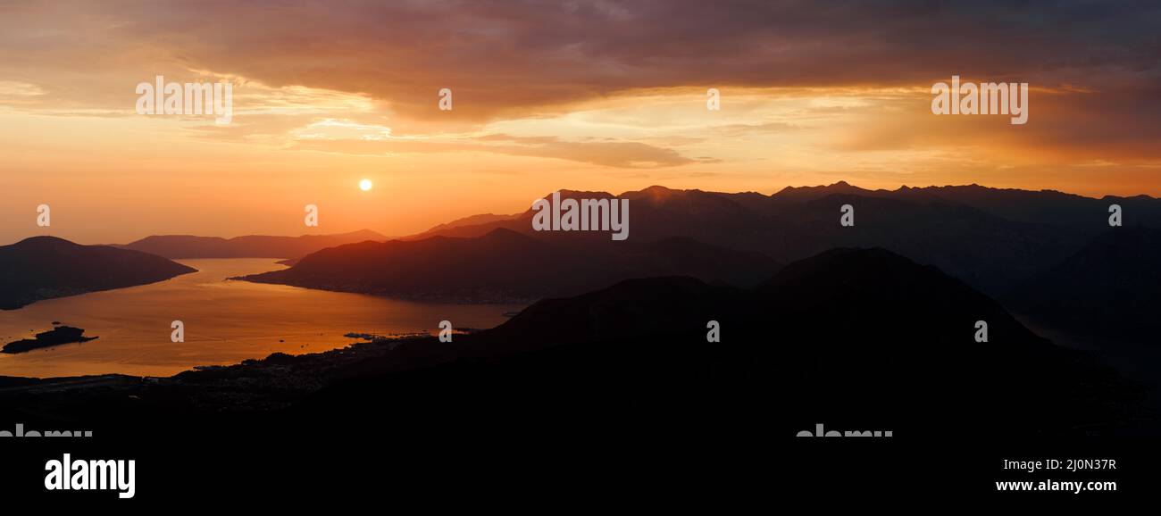 Mountains in the dark against the sunset sky. Mount Lovcen, Montenegro Stock Photo