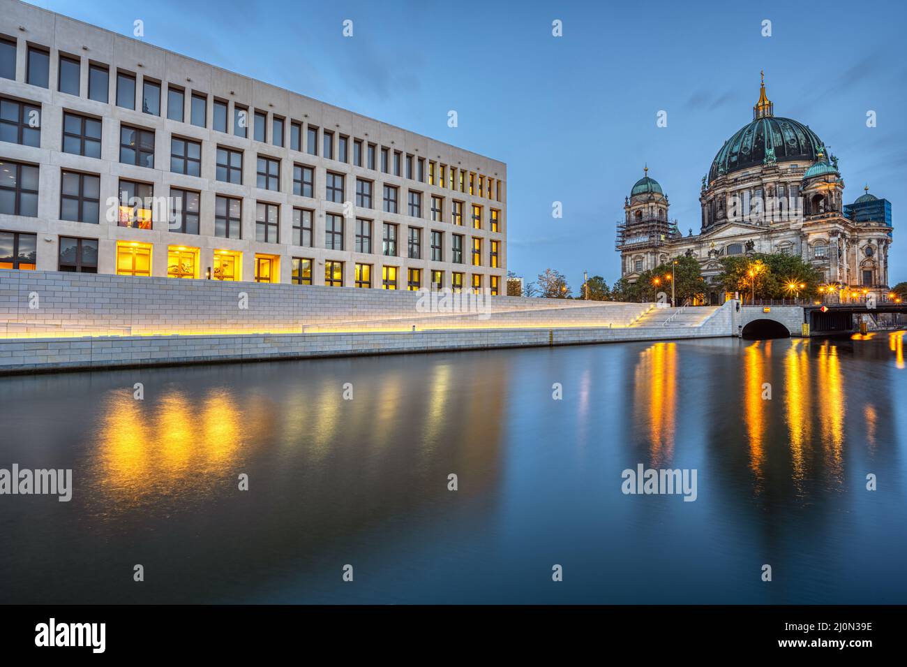 The modern backside of the City Palace, the Cathedral and the rvier Spree in Berlin at dawn Stock Photo