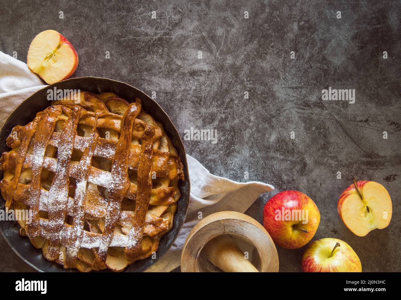 Baked apple pie wooden table with fruit Stock Photo