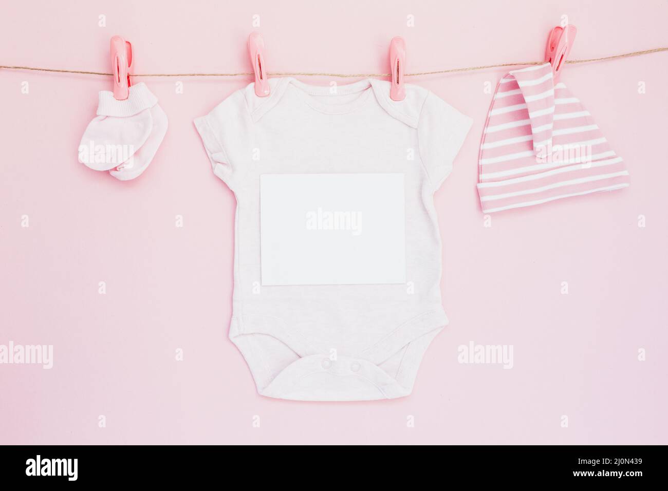 Composed childish clothes string Stock Photo Alamy