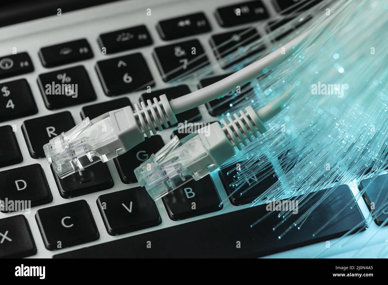 Blue optic fiber with cables laptop Stock Photo Alamy