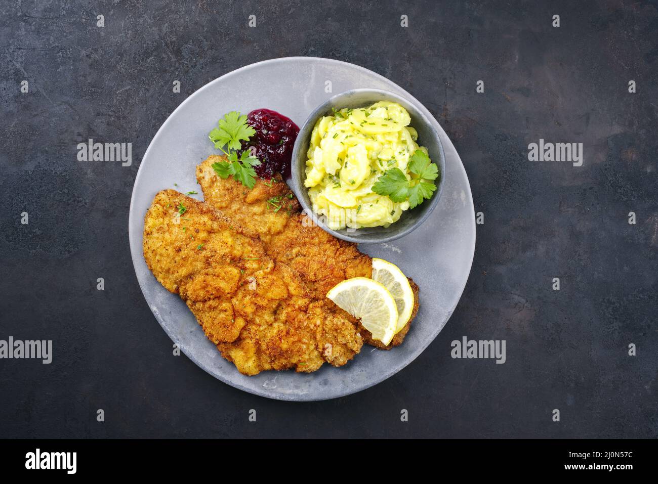 Traditional deepfried schnitzel with potato salad Stock Photo Alamy