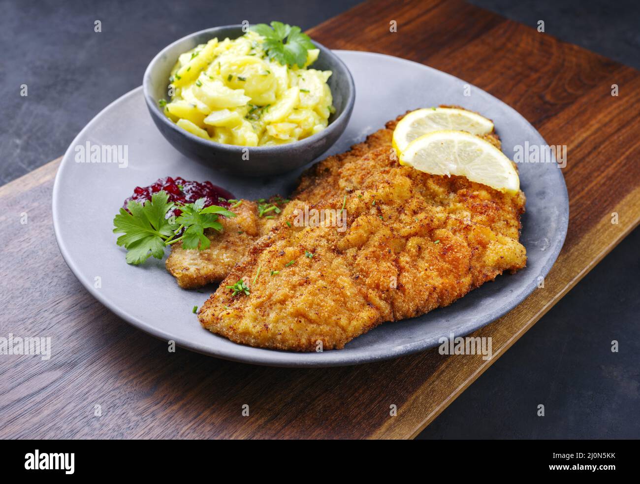 Traditional deepfried schnitzel with potato salad Stock Photo Alamy