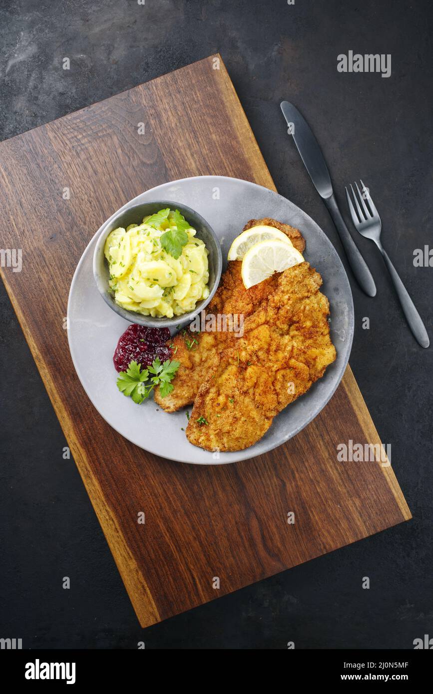 Traditional deepfried schnitzel with potato salad Stock Photo Alamy