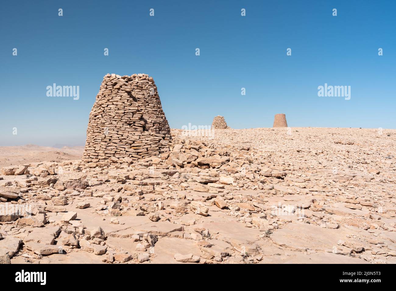 Bronze Age beehive burial tombs near Jaylah (Shir) in the Western Hajar Mountains of Oman Stock Photo